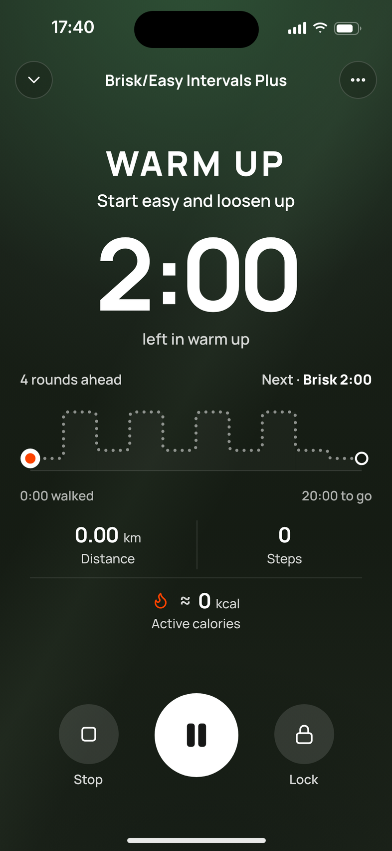 An interval walk in Mova starting: warm up, 2:00 left, with 4 rounds ahead and brisk next for 2 minutes.