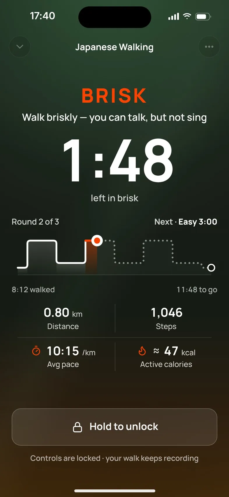 The walk screen with locked controls and the Hold to unlock button.